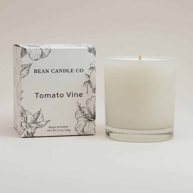 Candle and packaging of Bean Candle Co Tomato Vine candle on a beige background